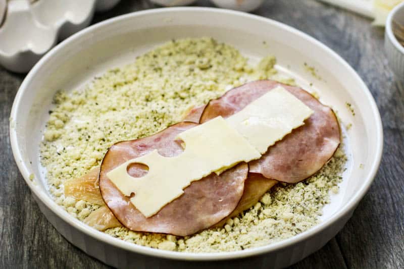 unwrapped chicken cordon bleu in almond flour mix